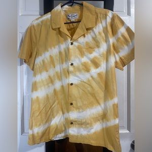A mustard color, short sleeve, casual button up